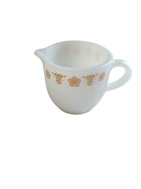 vintage Pyrex creamer pitcher in the Butterfly Gold pattern